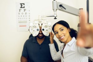 Optometrist checking vision